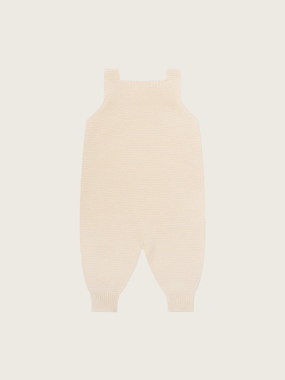 baby and toddler undyed cotton knitted salopette in cream with wooden buttons