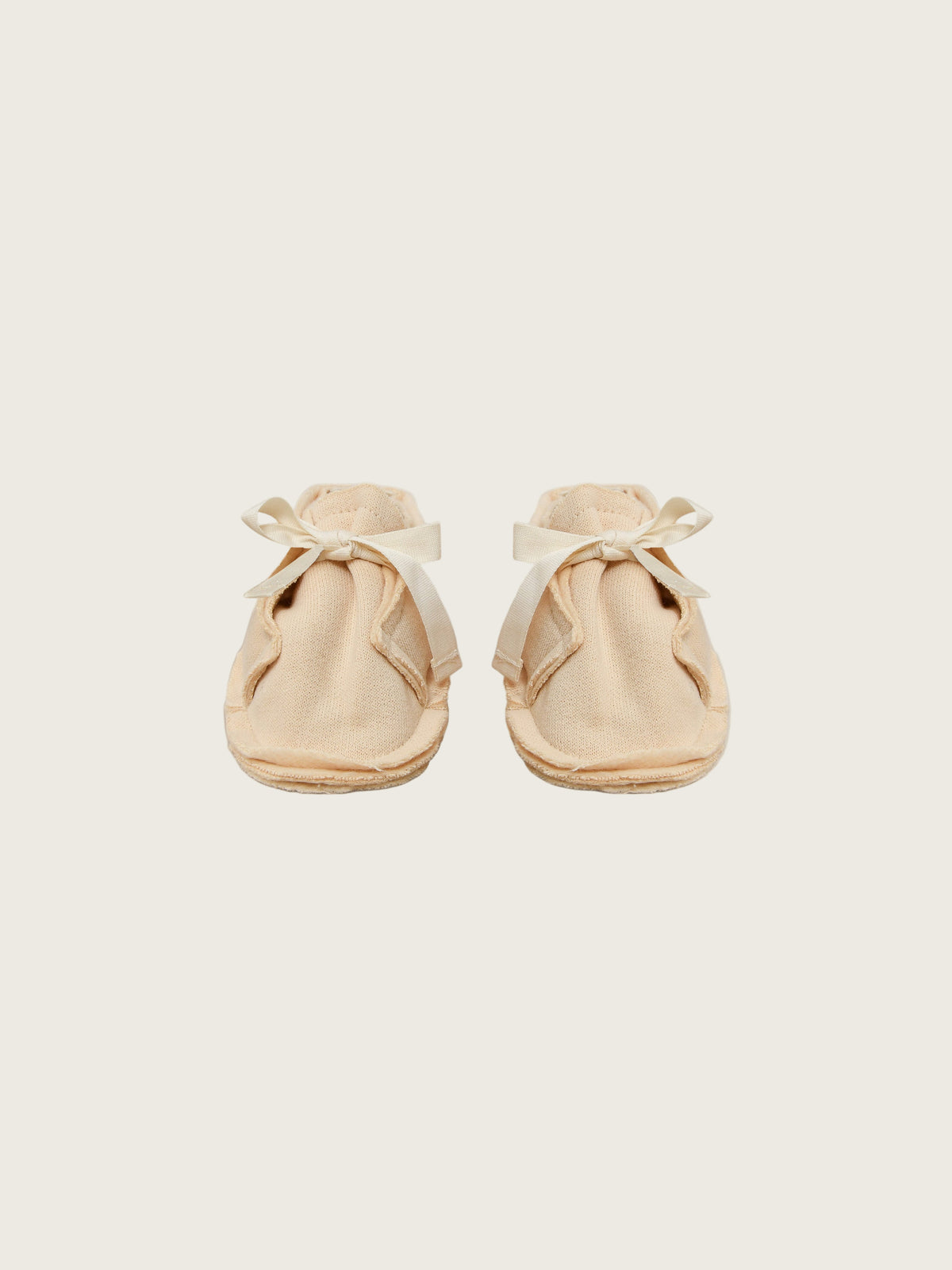 baby and toddler terry cotton booties in cream with white bow