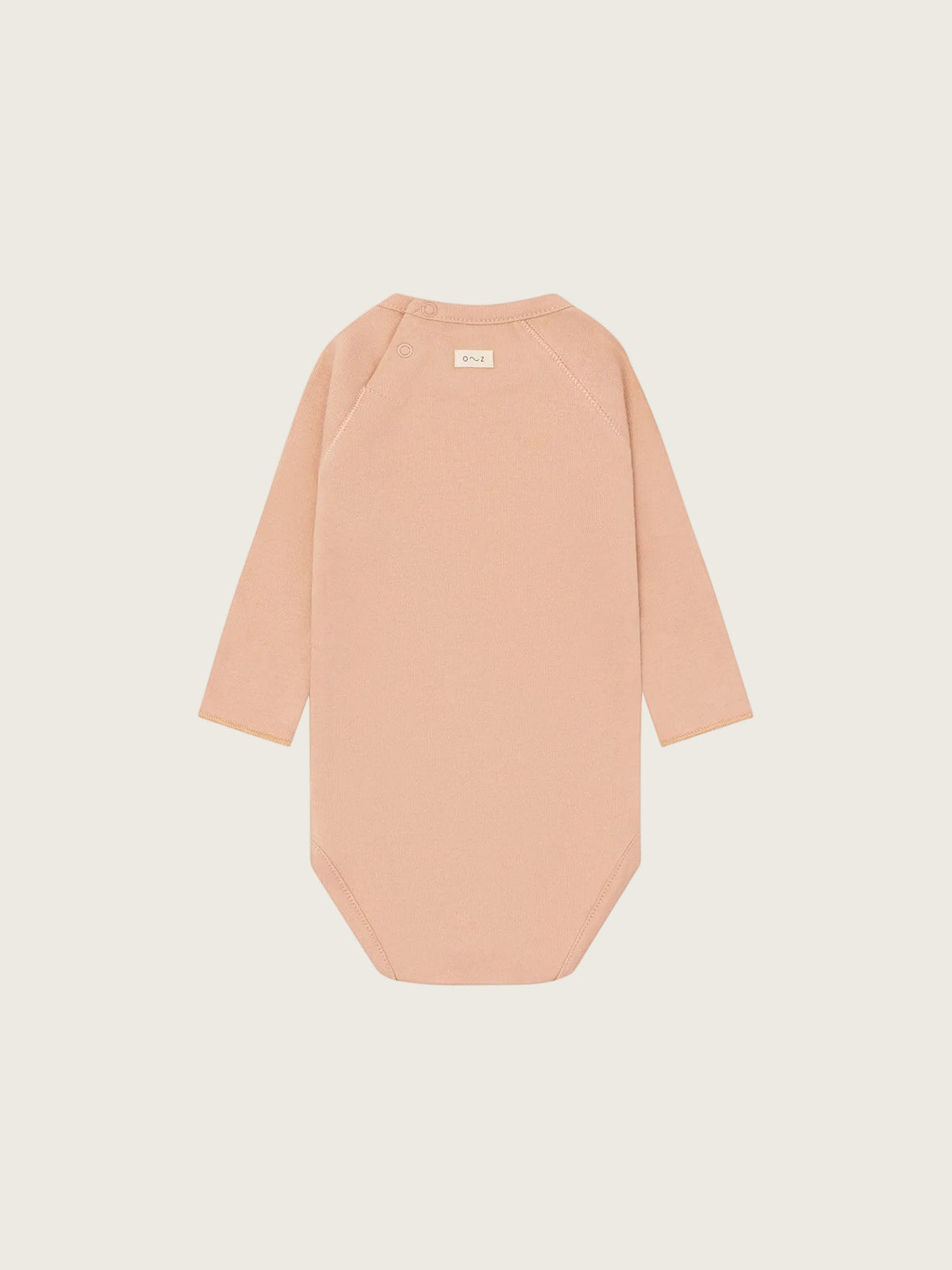 Beige bodysuit with long sleeves on a white background