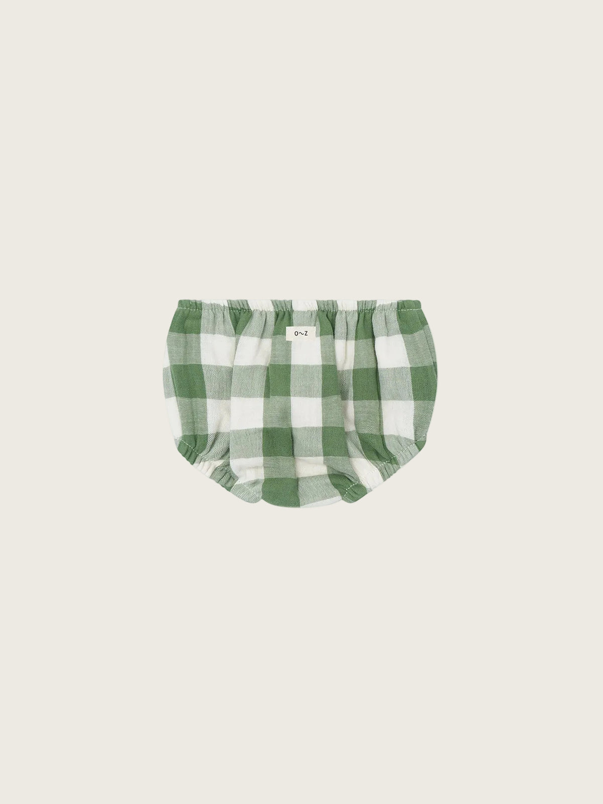 Green and white checkered baby shortie on a white background