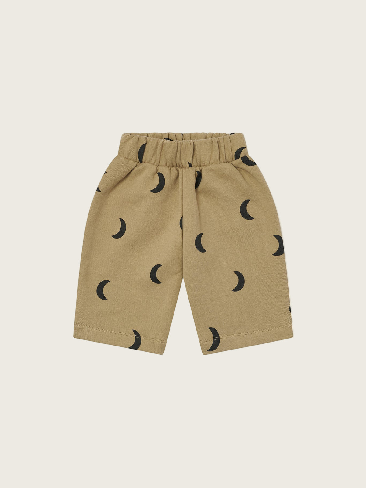baby and toddler dusky beige trousers with black crescent moon print and elastic waistband