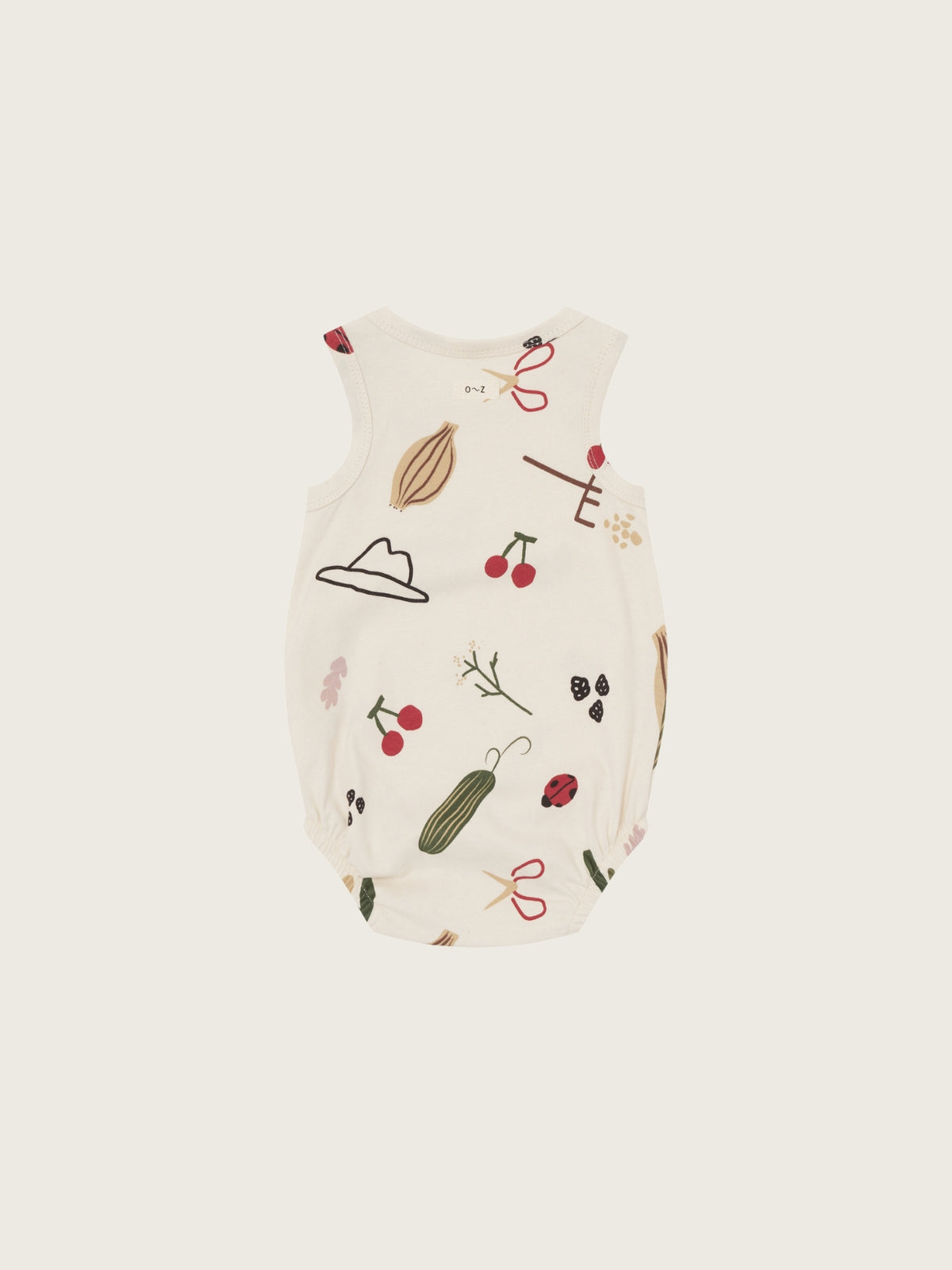 Baby bodysuit with nature-themed print on a white background