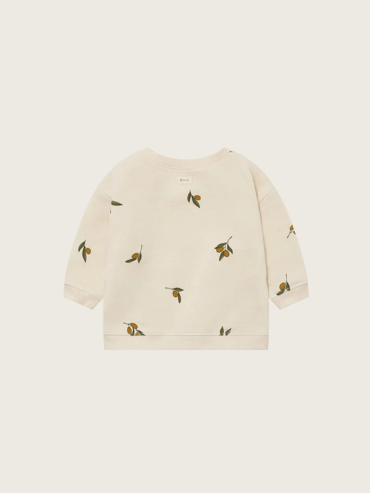Beige sweater with olive patterns on a white background