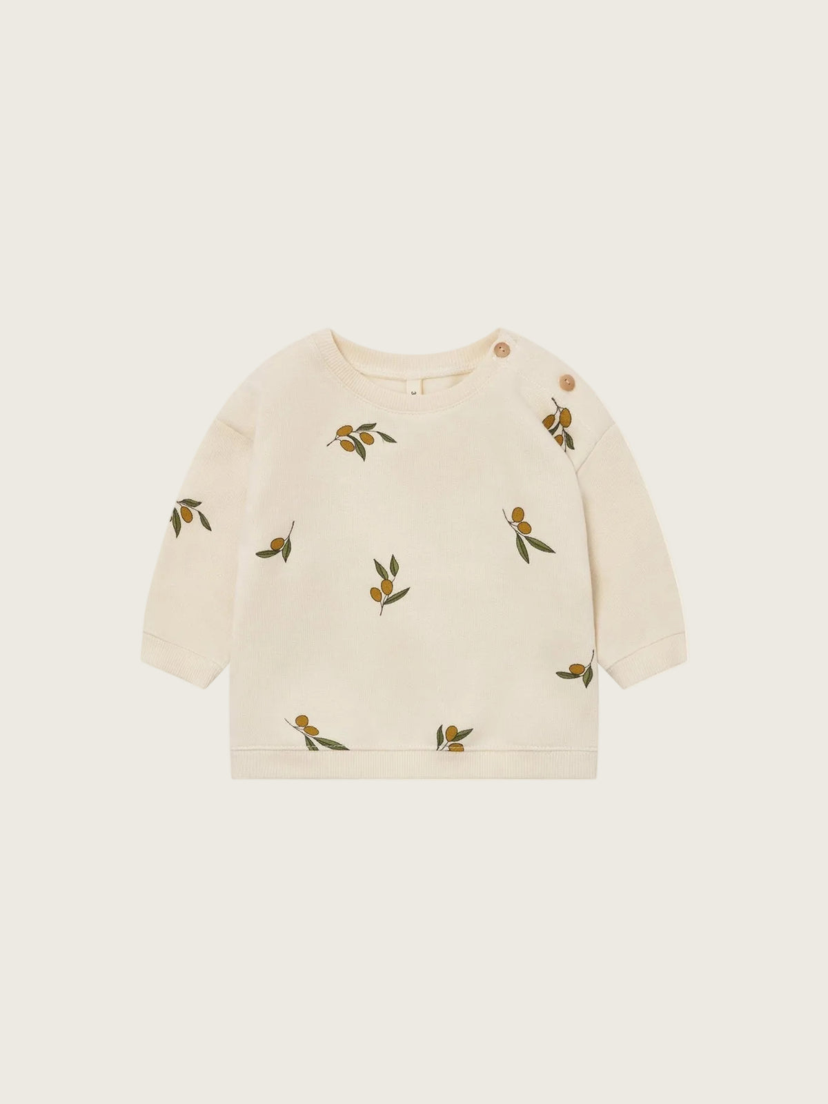 Beige sweater with olive patterns on a white background