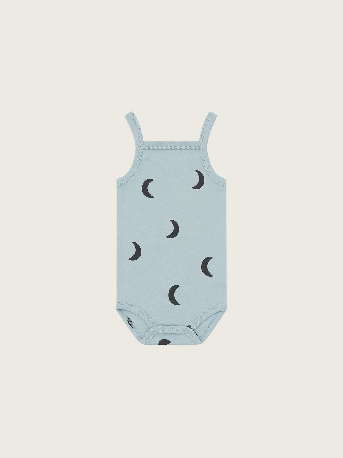 Light blue baby romper with black moon patterns on a white background