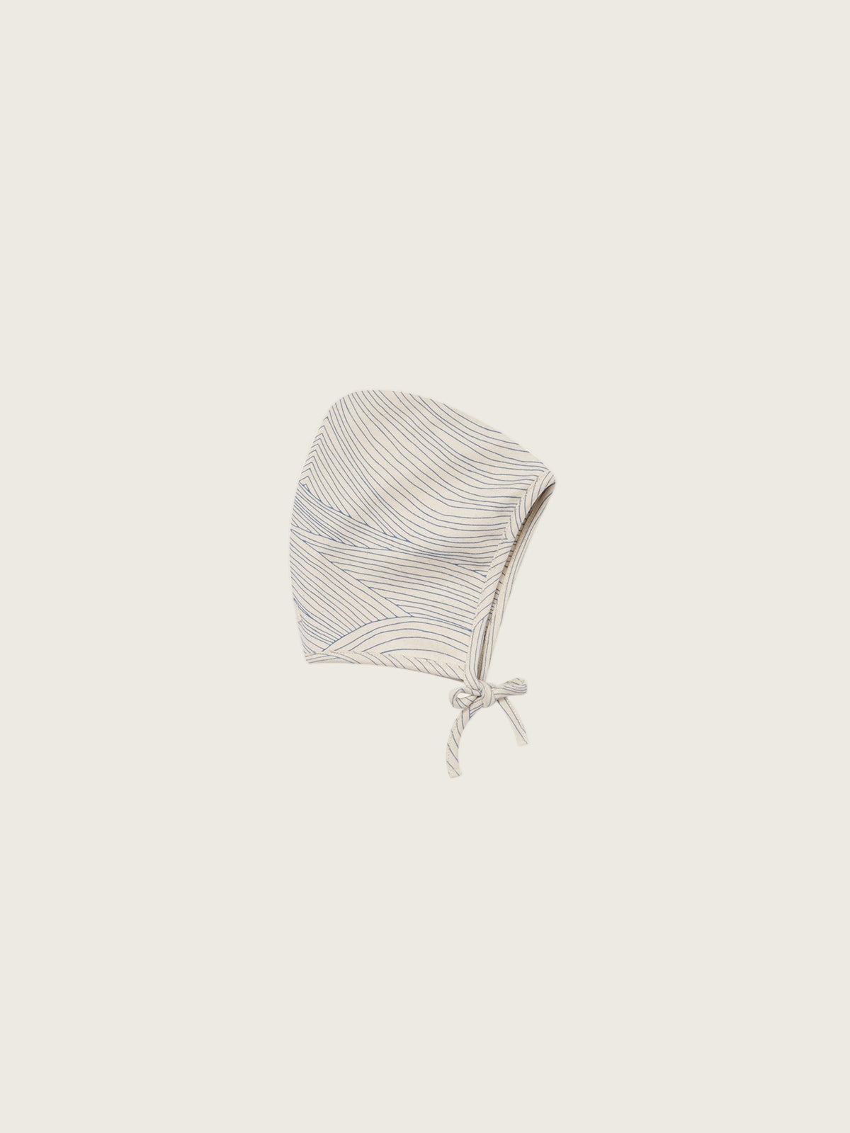 baby cream undyed cotton pixie bonnet with blue line-drawn ocean waves, and chin tie