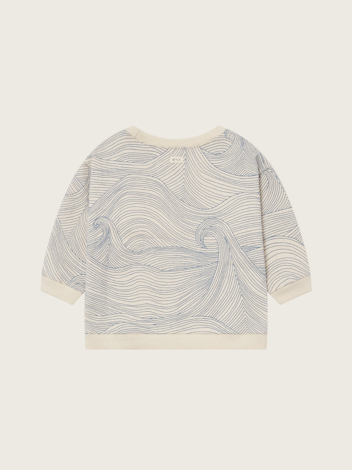 toddler cream undyed cotton sweatshirt with Seascape design of flowing blue line-drawn ocean waves