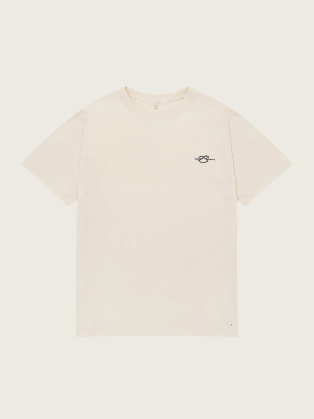 Beige t-shirt with a small logo on a white background