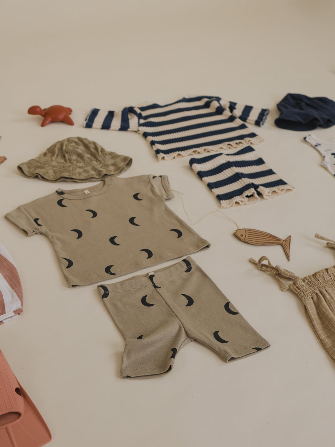 flatlay outfit matching dusky beige ribbed cotton biker shorts & t-shirt with black moon print