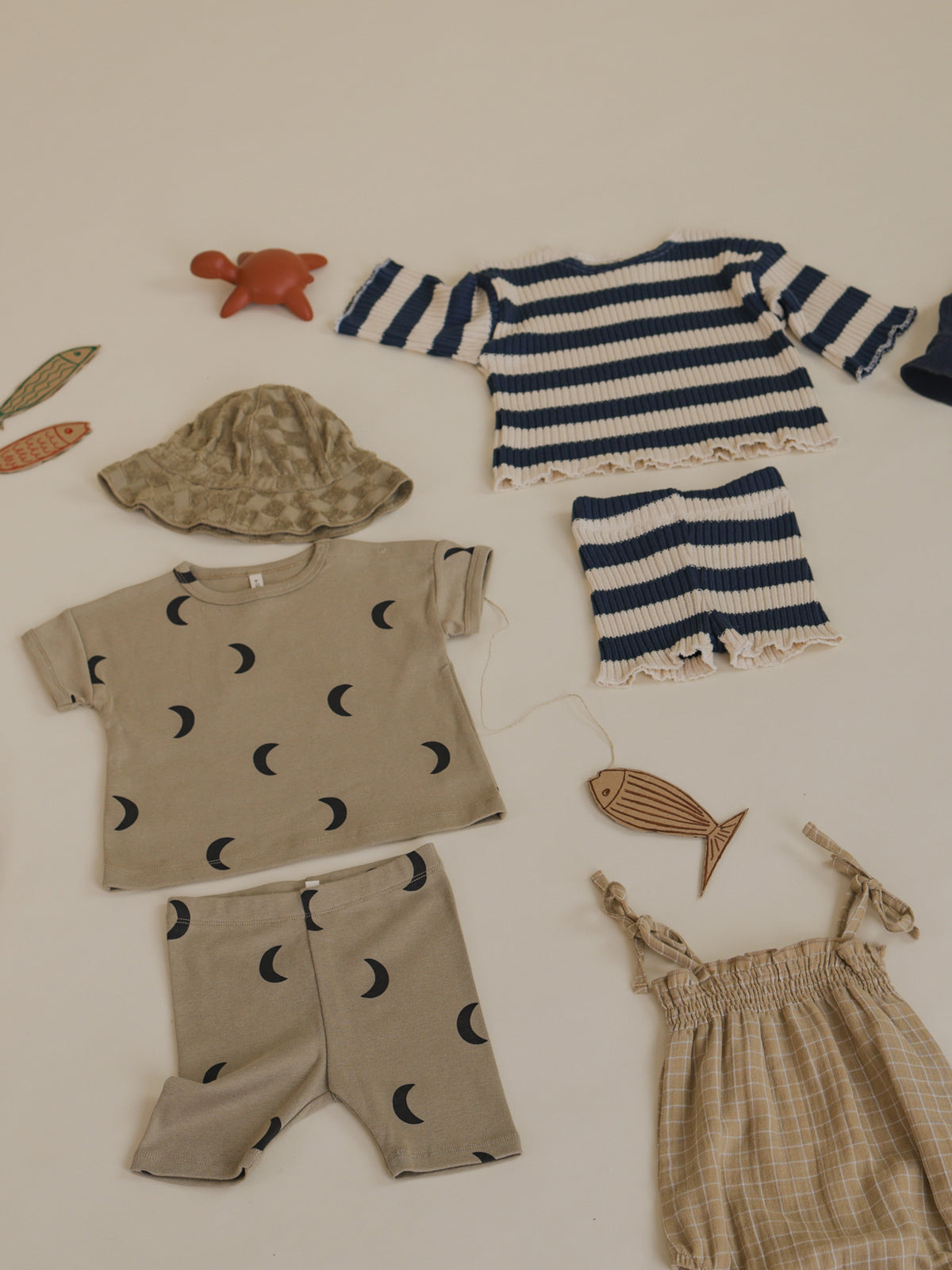 outfit flatlay matching toddler rib knitted sweater & shorts with navy sailor stripes