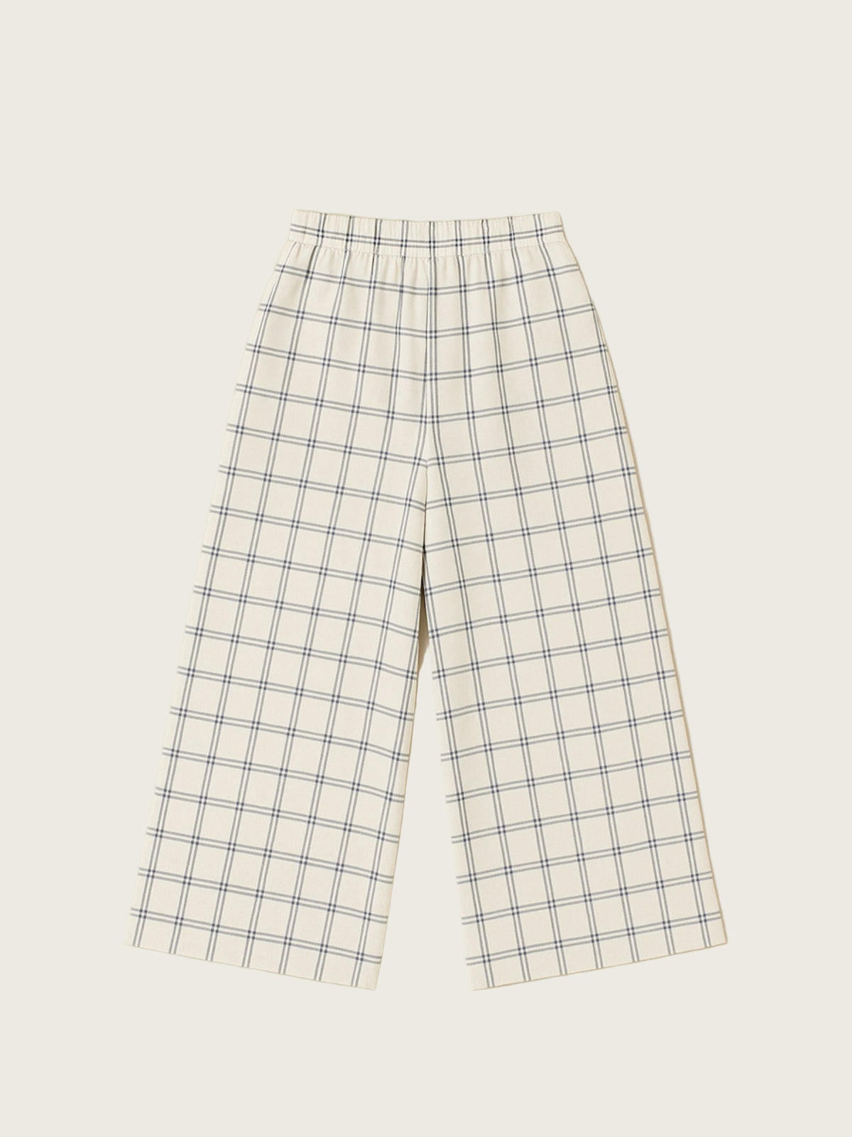 Plaid pants on a light beige background