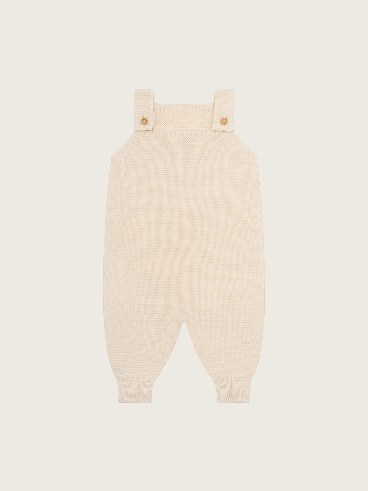 baby and toddler undyed cotton knitted salopette in cream with wooden buttons