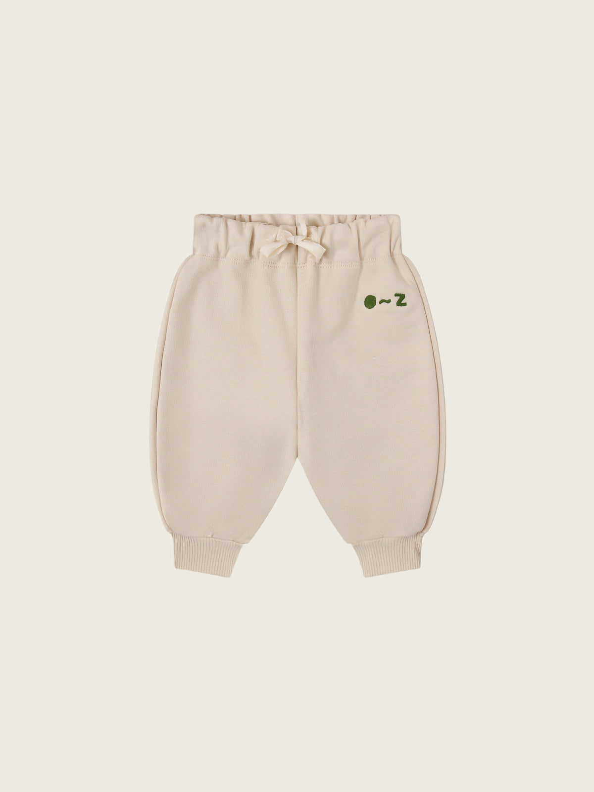 baby and toddler undyed cotton drawstring sweatpants in cream with O ~ Z embroidered in green