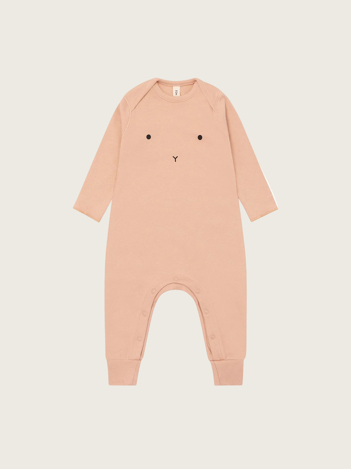 Pink baby onesie with bunny face design on a white background
