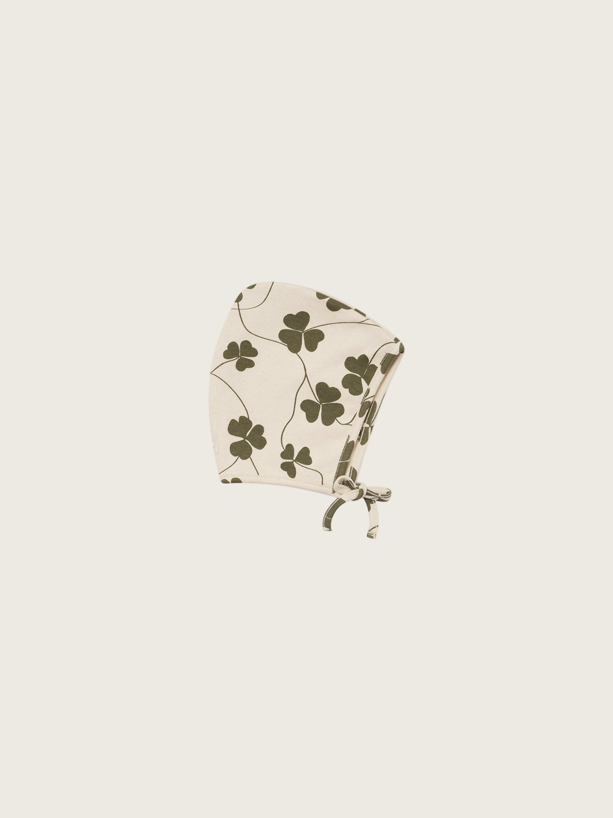 baby cream undyed cotton pixie bonnet with green clover print and chin tie