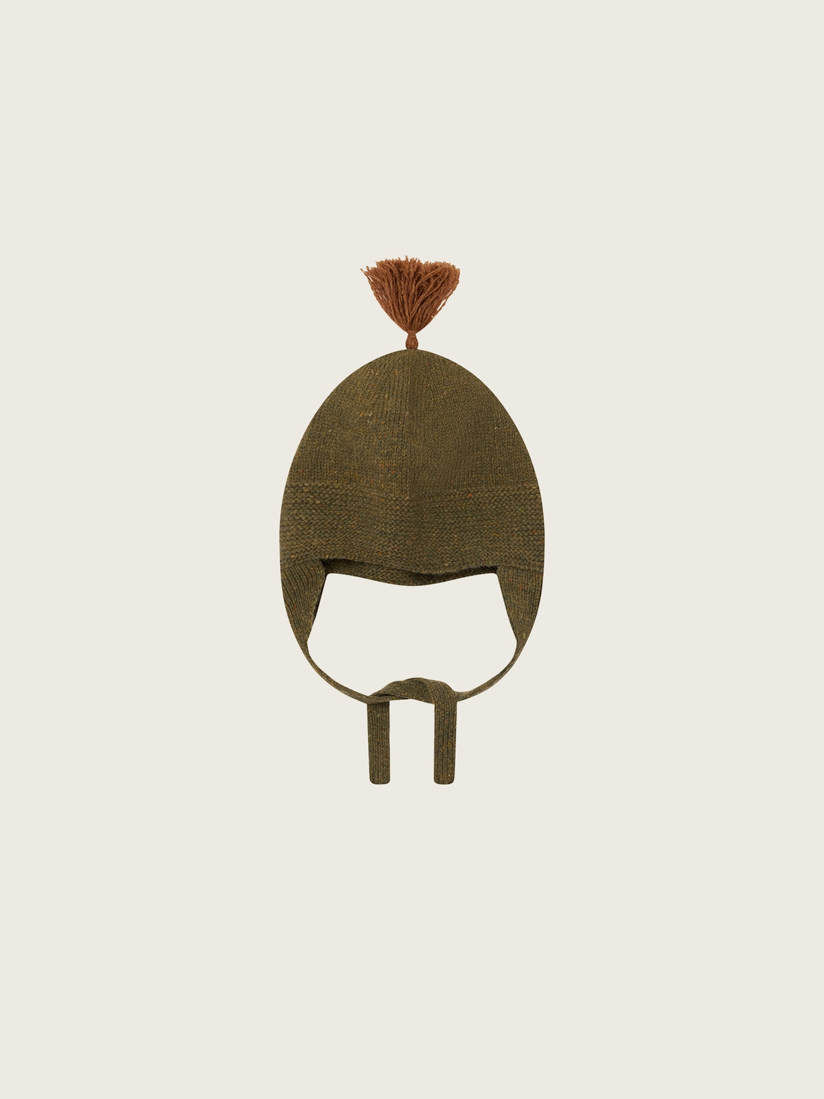 Green beanie with a brown pom-pom on a beige background