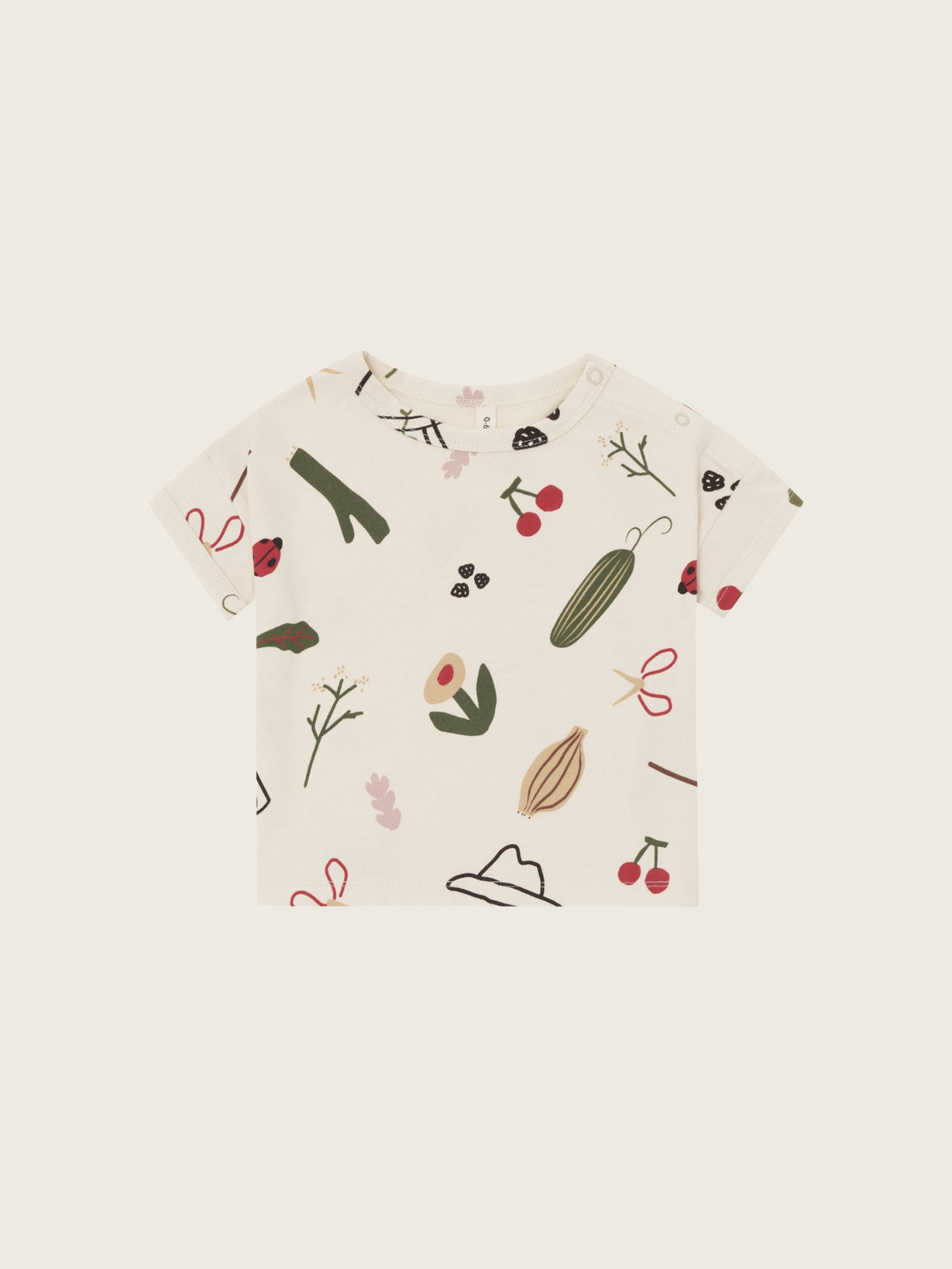 Baby t-shirt with vegetable pattern on a white background