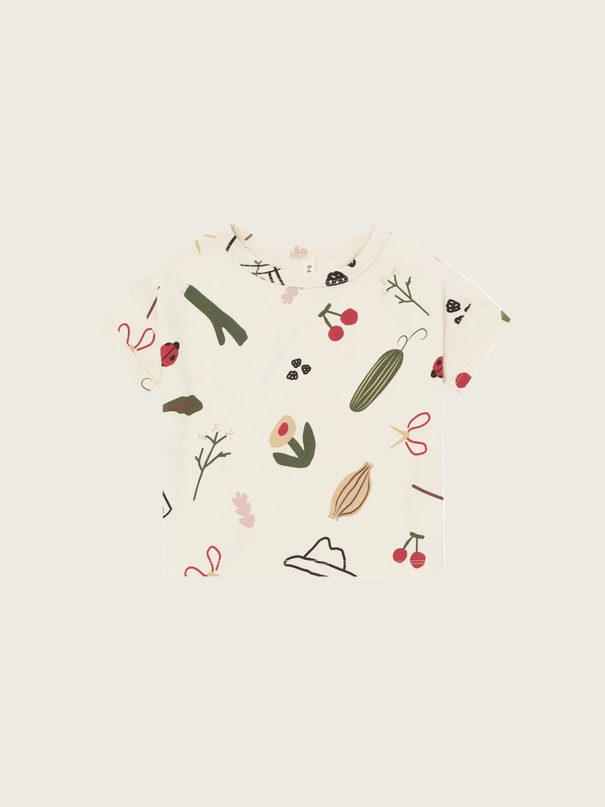 Beige t-shirt with nature-themed illustrations on a white background
