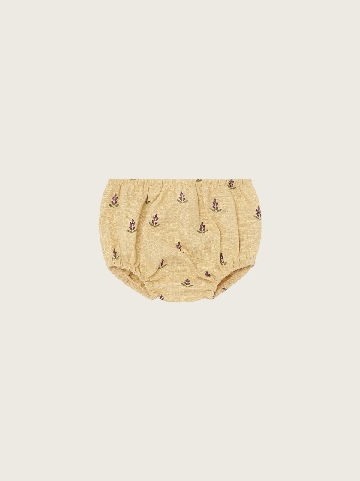 Beige baby shorties with lavender patterns on a white background