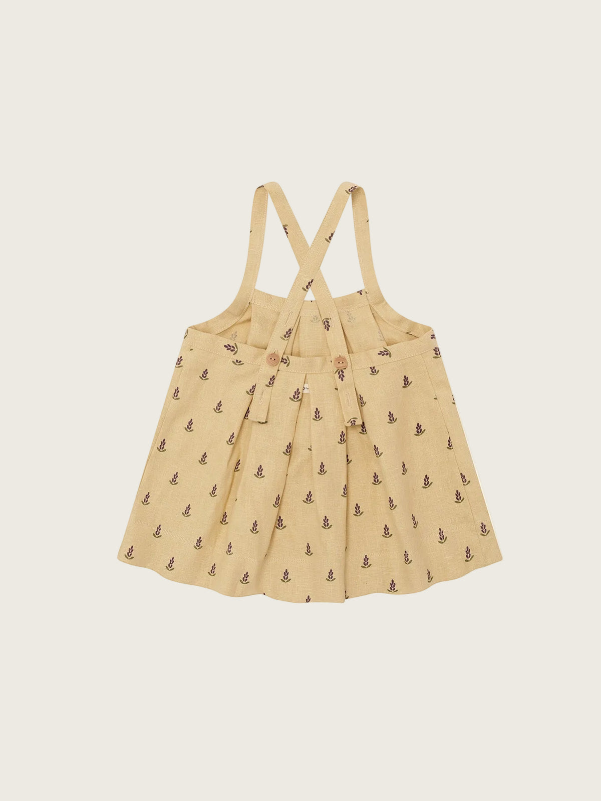 Beige dress with suspenders on a white background