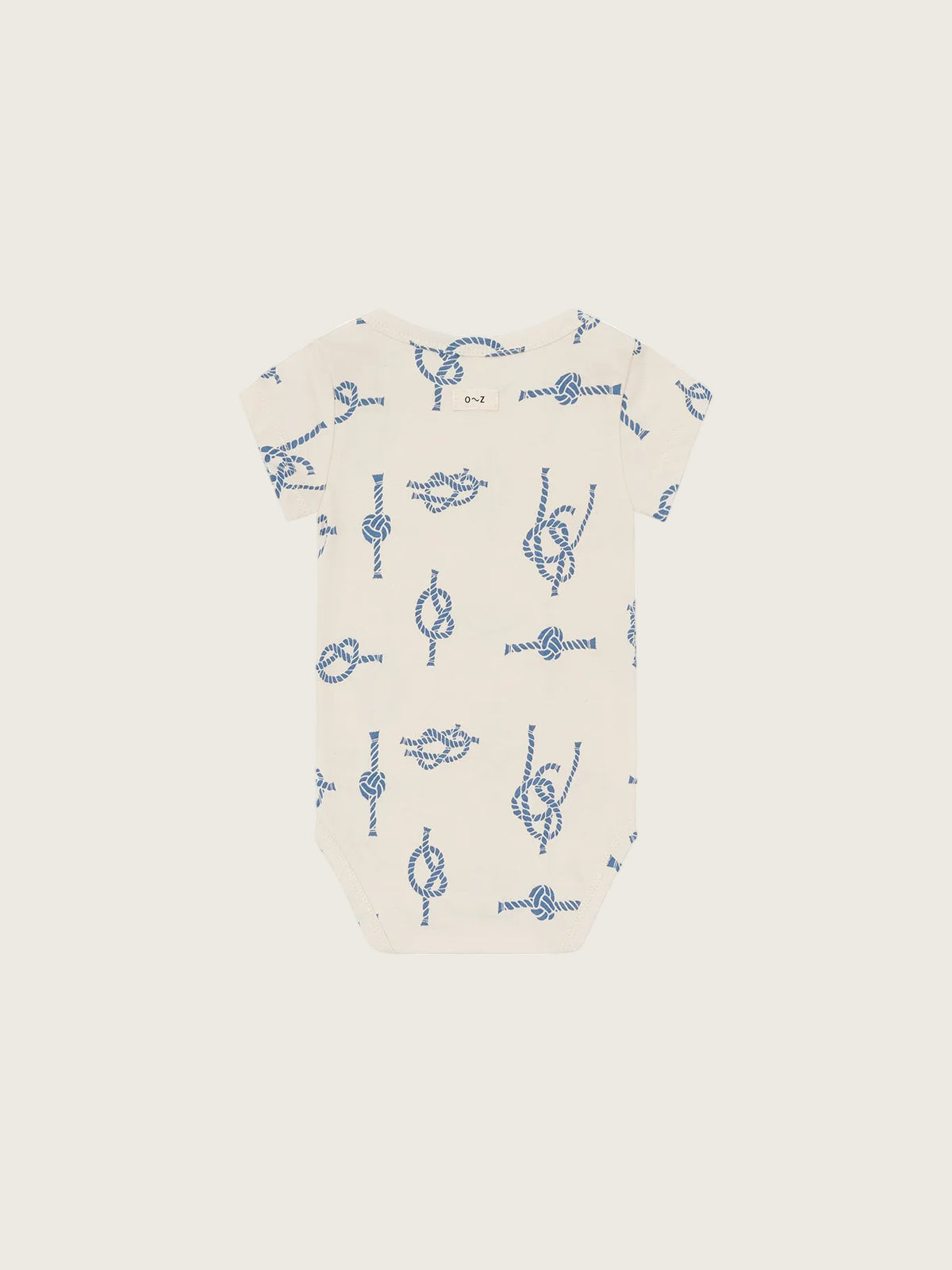 Baby onesie with blue patterns on a white background