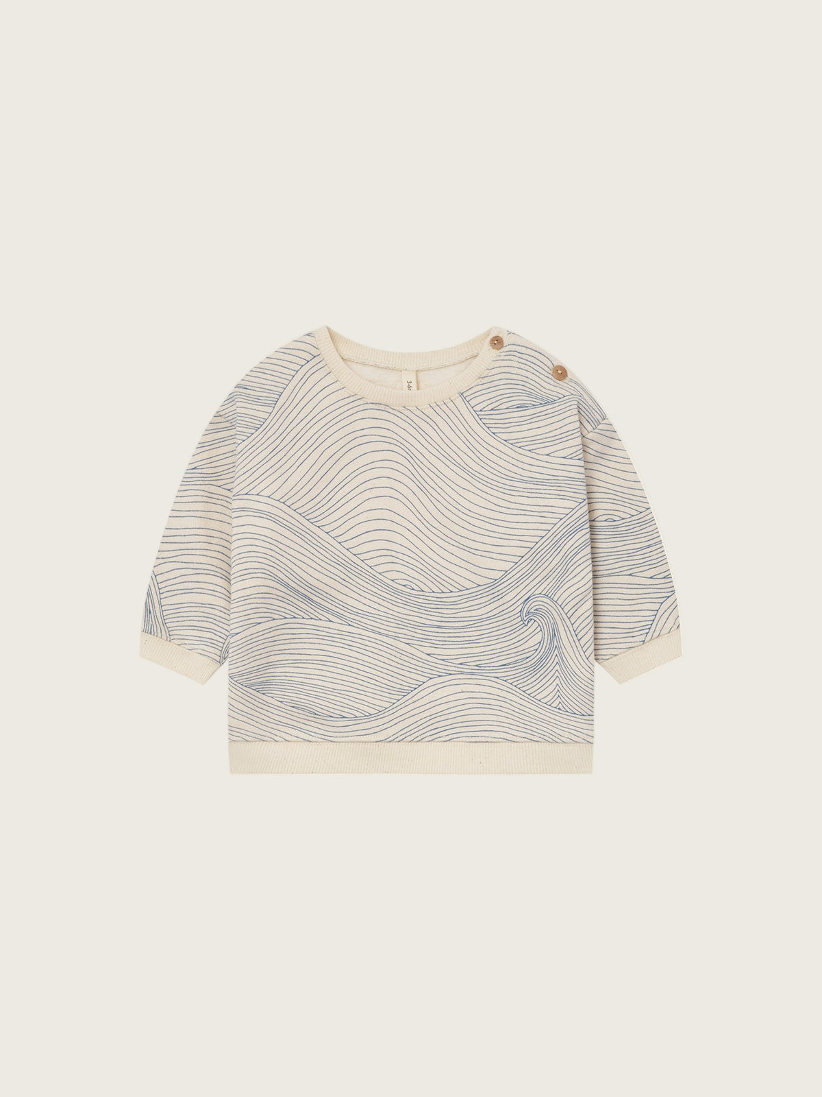 baby cream undyed cotton sweatshirt with shoulder buttons and blue Seascape line-drawn ocean waves