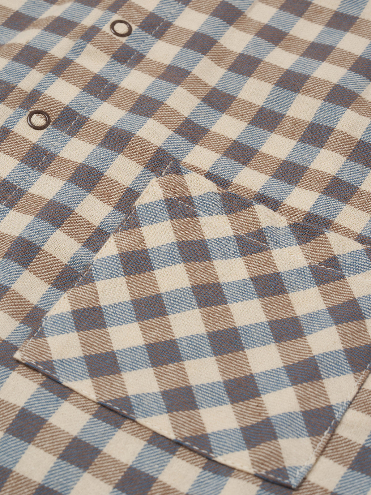 close up of gingham lodge shirt in cream & blue with peter pan collar, patch pockets & balloon sleeves