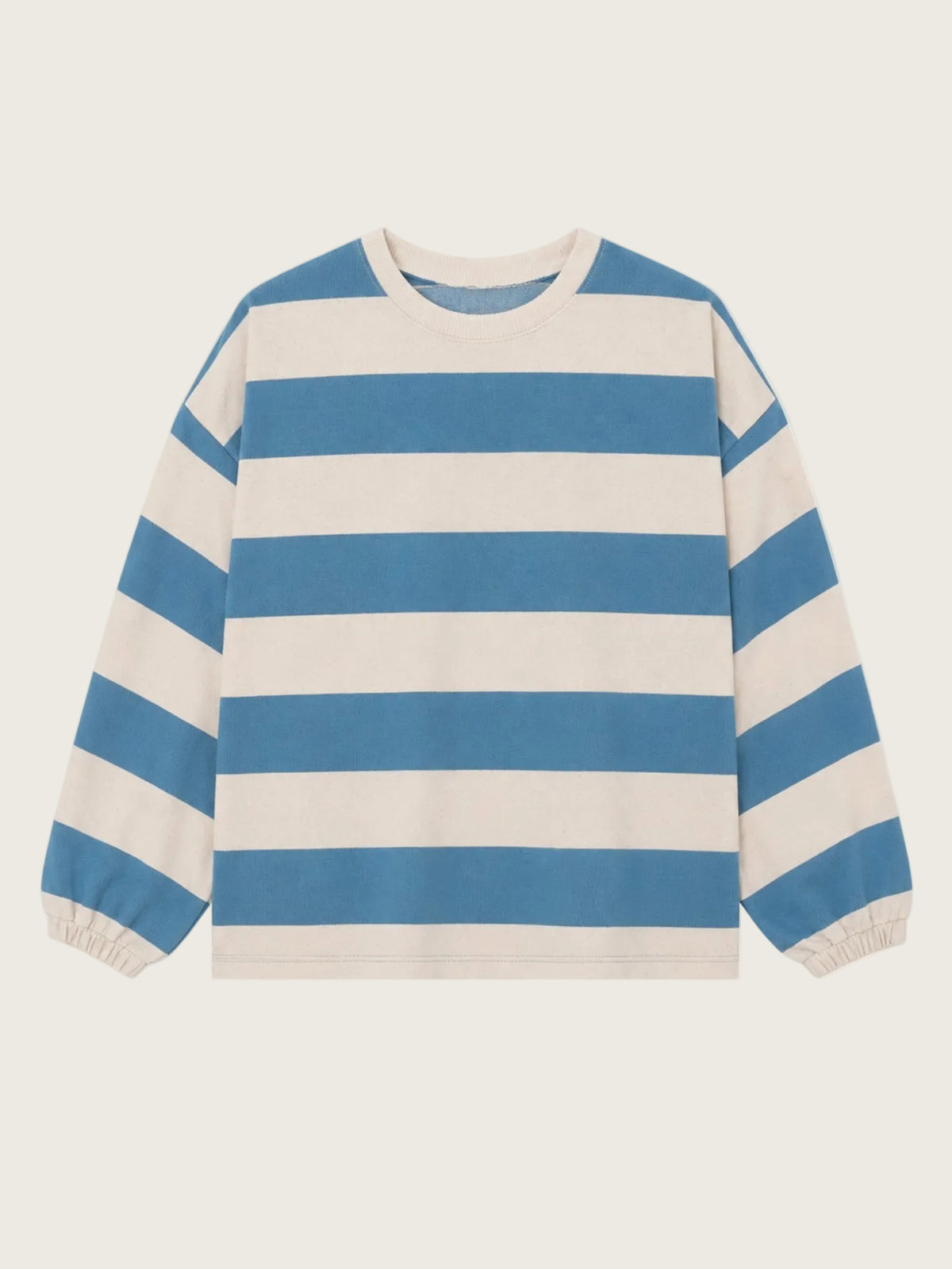 Blue and white striped sweater on a beige background