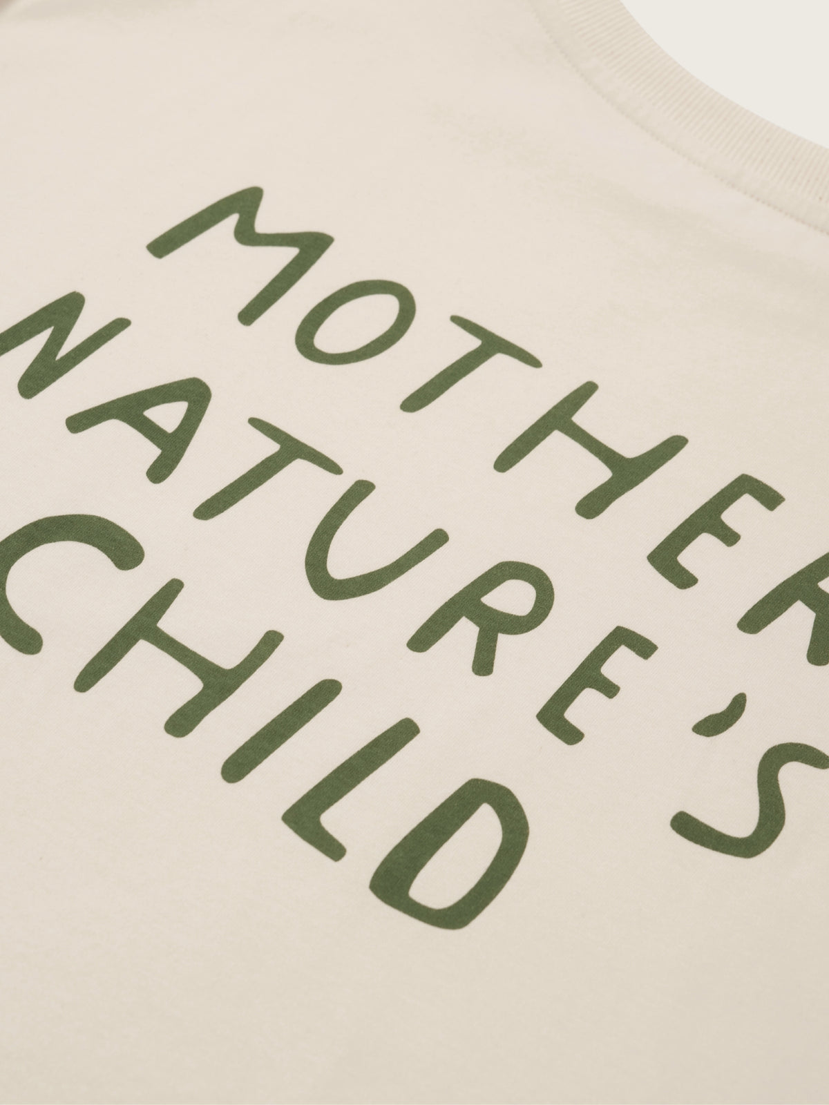 Text 'MOTHER NATURE'S CHILD' printed on a beige background